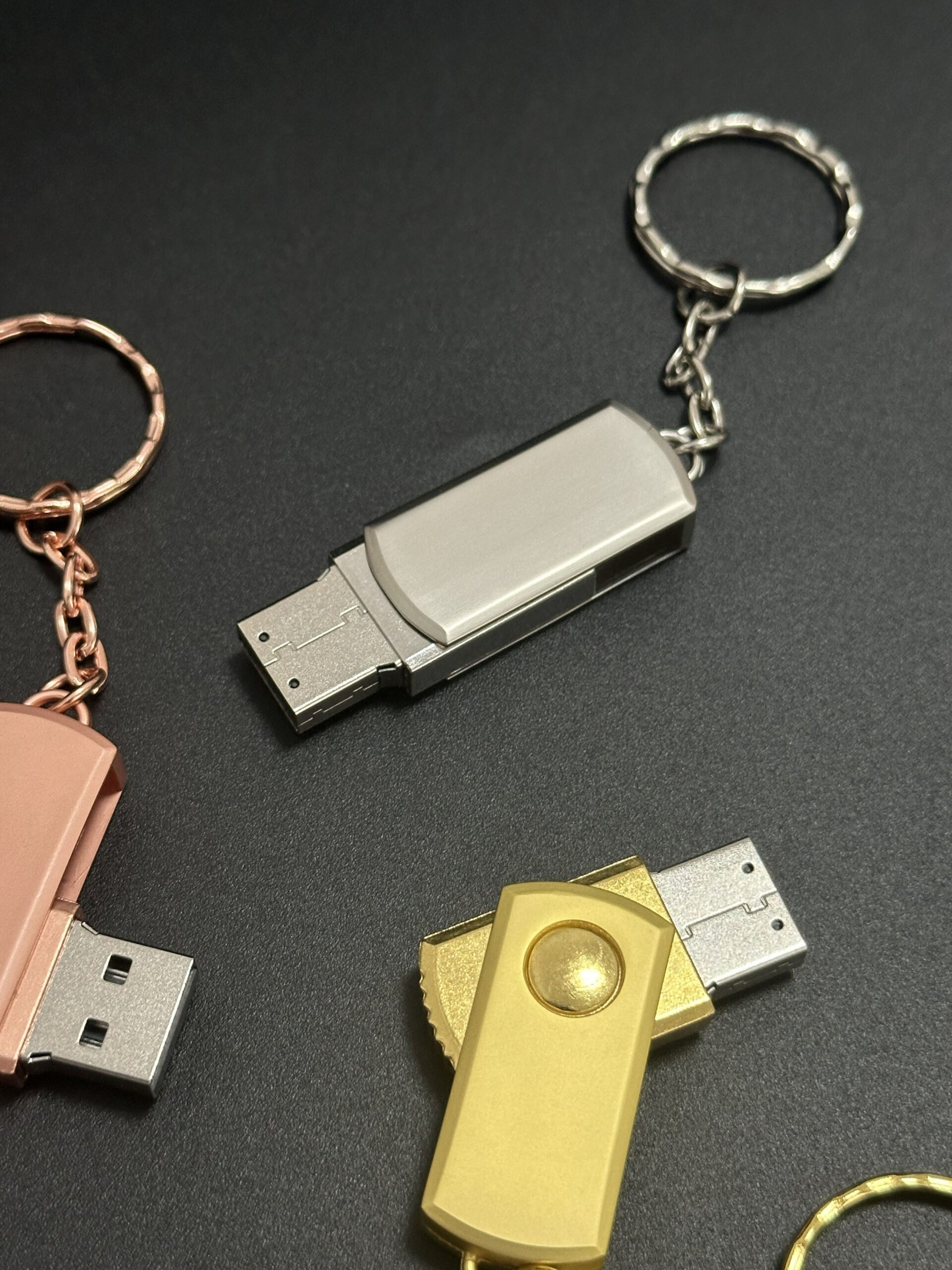 Three pink gold silver metal swivel pendrive attached together