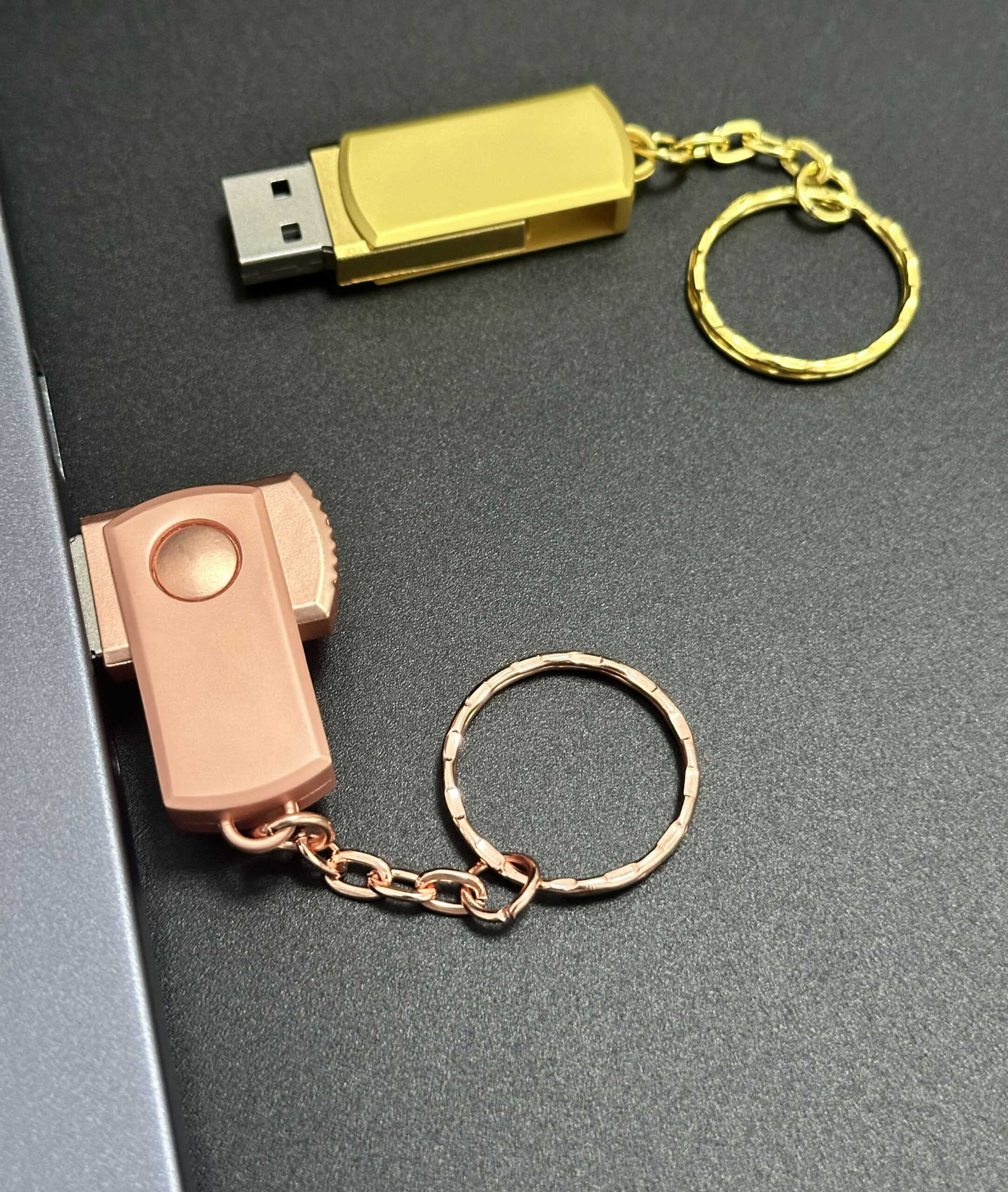 Metal swivel pendrive in rotation motion showing 360-degree swivel action