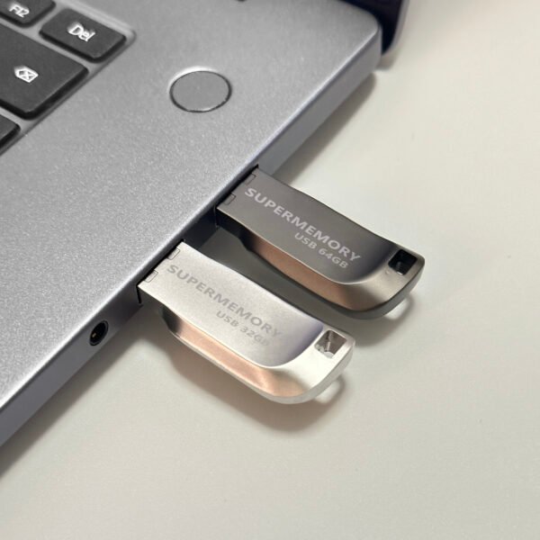 Side view of CZ74 metal USB flash drive highlighting 4mm ultra-slim thickness against fingertip