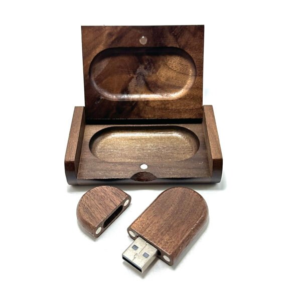 Interior of wooden storage case with custom carved hollow perfectly holding the walnut USB drive